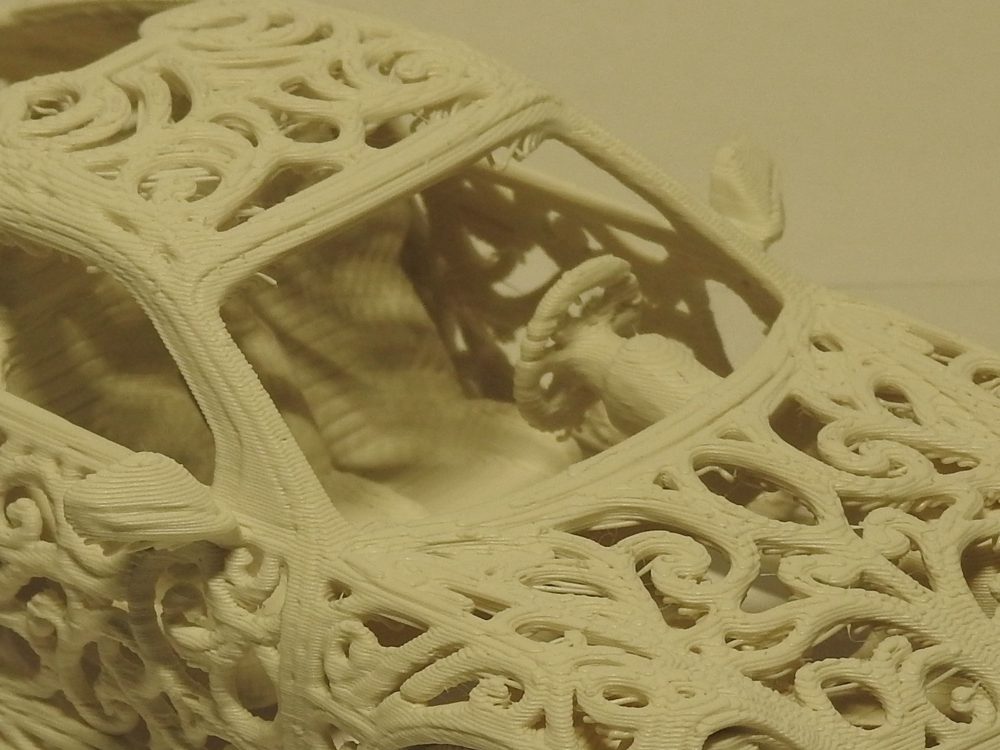 Close up looking down through the lattice roof of the printed GT3 at the bucket seat and steering wheel inside